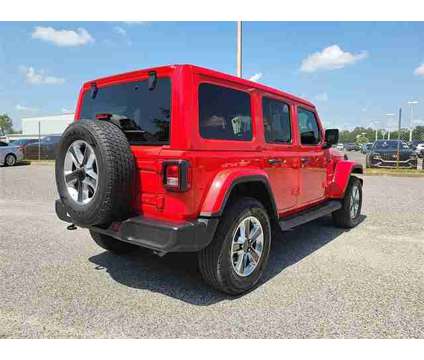 2021 Jeep Wrangler Unlimited Sahara is a Red 2021 Jeep Wrangler Unlimited Car for Sale in Orlando FL