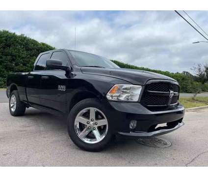 2014 Ram 1500 Quad Cab for sale is a Black 2014 RAM 1500 Model Car for Sale in Raleigh NC