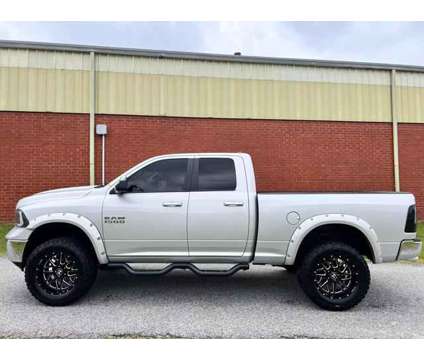2014 Ram 1500 Quad Cab for sale is a Silver 2014 RAM 1500 Model Car for Sale in Greensboro NC