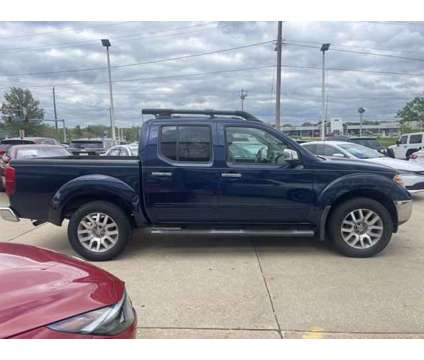 2010 Nissan Frontier is a Blue 2010 Nissan frontier Car for Sale in Des Moines IA