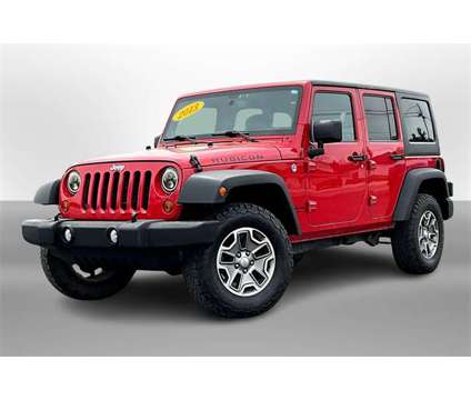 2013 Jeep Wrangler Unlimited Rubicon is a Red 2013 Jeep Wrangler Unlimited Rubicon SUV in Durand MI
