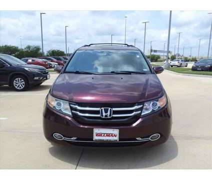 2015 Honda Odyssey Touring is a Red 2015 Honda Odyssey Touring Car for Sale in Rosenberg TX