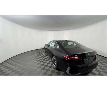 2025 BMW i5 xDrive40 is a Black 2025 Sedan in Freeport NY