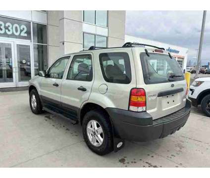 2005UsedFordUsedEscapeUsed4dr 103 WB 2.3L 4WD is a Tan 2005 Ford Escape Car for Sale in Fargo ND