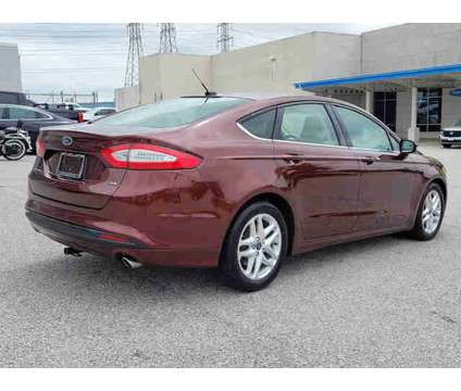 2016 Ford Fusion SE is a Tan 2016 Ford Fusion SE Car for Sale in Dundalk MD