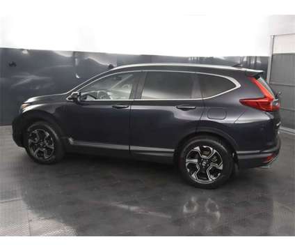 2019 Honda CR-V Touring is a 2019 Honda CR-V Touring SUV in Rochester NY