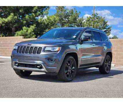 2014 Jeep Grand Cherokee Overland is a Grey 2014 Jeep grand cherokee Overland Car for Sale in Denver CO