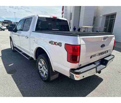 2019 Ford F-150 Lariat is a Silver, White 2019 Ford F-150 Lariat Truck in Fort Dodge IA