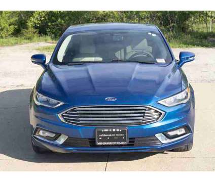 2017 Ford Fusion Energi Titanium is a Blue 2017 Ford Fusion Energi Titanium Sedan in Peoria IL