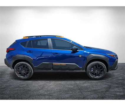 2024 Subaru Crosstrek Wilderness is a Blue 2024 Subaru Crosstrek 2.0i SUV in Vero Beach FL