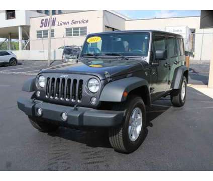2017 Jeep Wrangler Unlimited Sport 4x4 is a Grey 2017 Jeep Wrangler Unlimited Sport SUV in Lansing MI