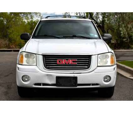 2003 GMC Envoy SLE is a White 2003 GMC Envoy SLE SUV in Denver CO