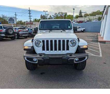 2020 Jeep Wrangler Unlimited Sahara is a White 2020 Jeep Wrangler Unlimited Sahara Car for Sale in Colorado Springs CO