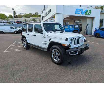 2020 Jeep Wrangler Unlimited Sahara is a White 2020 Jeep Wrangler Unlimited Sahara Car for Sale in Colorado Springs CO