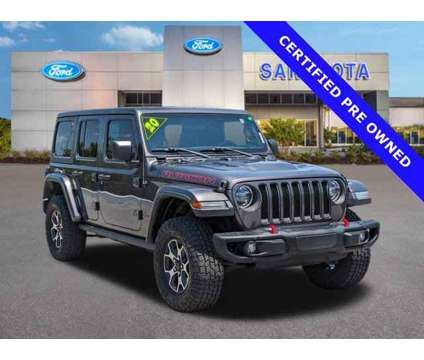 2020 Jeep Wrangler Unlimited Rubicon is a Grey 2020 Jeep Wrangler Unlimited Car for Sale in Sarasota FL