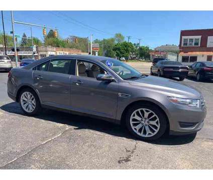 2013 Ford Taurus for sale is a Grey 2013 Ford Taurus Car for Sale in Toledo OH