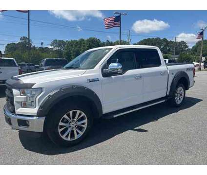 2016 Ford F-150 Lariat is a White 2016 Ford F-150 Lariat Truck in Greenville NC