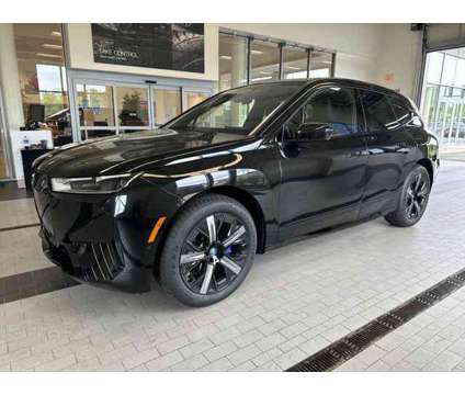 2025 BMW iX xDrive50 is a Black 2025 BMW 325 Model iX SUV in Westbrook ME