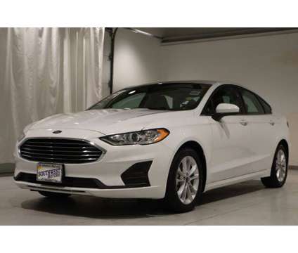 2020 Ford Fusion Hybrid SE is a White 2020 Ford Fusion Hybrid SE Hybrid in Pueblo CO