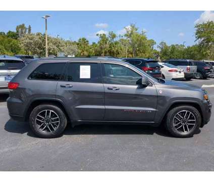 2020 Jeep Grand Cherokee Trailhawk is a Grey 2020 Jeep grand cherokee Trailhawk Car for Sale in Estero FL