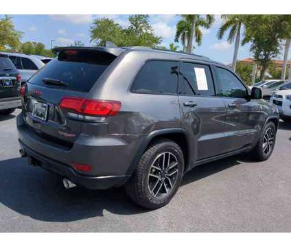 2020 Jeep Grand Cherokee Trailhawk is a Grey 2020 Jeep grand cherokee Trailhawk Car for Sale in Estero FL