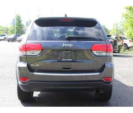2015 Jeep Grand Cherokee Limited is a Grey 2015 Jeep grand cherokee Limited Car for Sale in Traverse City MI