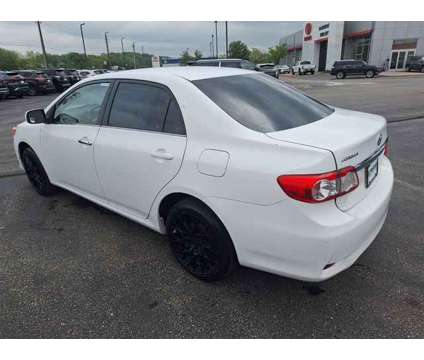 2013 Toyota Corolla LE is a White 2013 Toyota Corolla LE Sedan in Dubuque IA