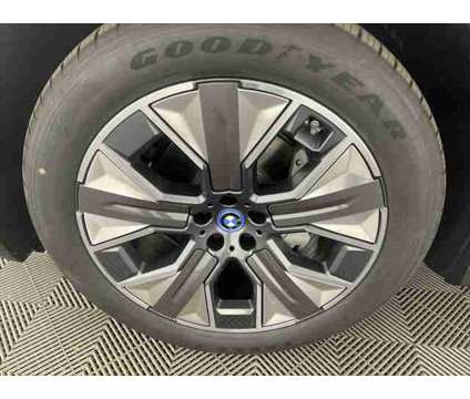 2025 BMW iX xDrive50 is a Blue 2025 BMW 325 Model iX SUV in Freeport NY