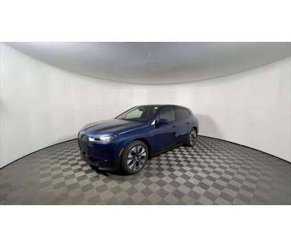 2025 BMW iX xDrive50 is a Blue 2025 BMW 325 Model iX SUV in Freeport NY