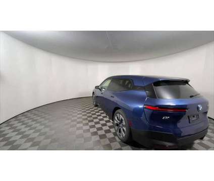 2025 BMW iX xDrive50 is a Blue 2025 BMW 325 Model iX SUV in Freeport NY
