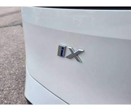 2025 BMW iX xDrive50 is a White 2025 BMW 325 Model iX SUV in Loveland CO