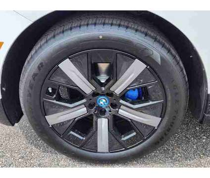 2025 BMW iX xDrive50 is a White 2025 BMW 325 Model iX SUV in Loveland CO