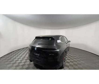 2025 BMW iX xDrive50 is a Black 2025 BMW 325 Model iX SUV in Freeport NY