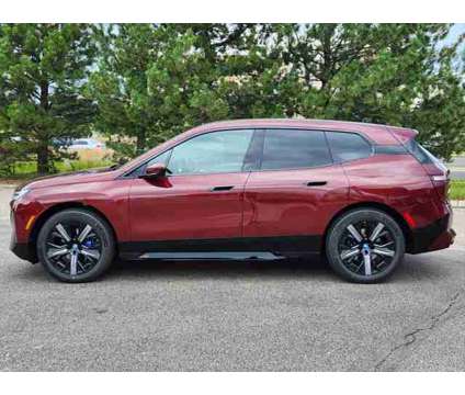 2025 BMW iX xDrive50 is a Red 2025 BMW 325 Model iX SUV in Loveland CO