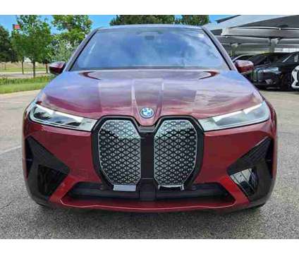 2025 BMW iX xDrive50 is a Red 2025 BMW 325 Model iX SUV in Loveland CO