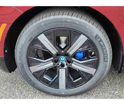 2025 BMW iX xDrive50 is a Red 2025 BMW 325 Model iX SUV in Loveland CO