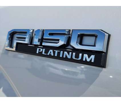 2015 Ford F-150 Platinum is a Silver, White 2015 Ford F-150 Platinum Truck in Loveland CO