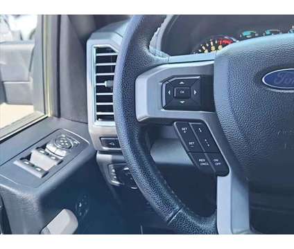 2015 Ford F-150 Platinum is a Silver, White 2015 Ford F-150 Platinum Truck in Loveland CO