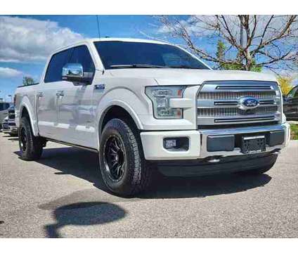 2015 Ford F-150 Platinum is a Silver, White 2015 Ford F-150 Platinum Truck in Loveland CO