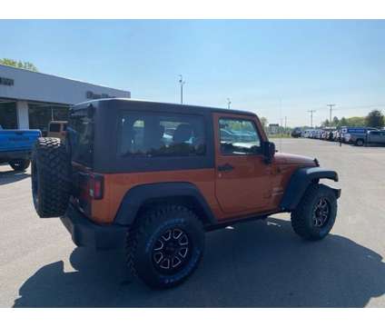2011 Jeep Wrangler Sport is a Yellow 2011 Jeep Wrangler Sport SUV in Houghton Lake MI