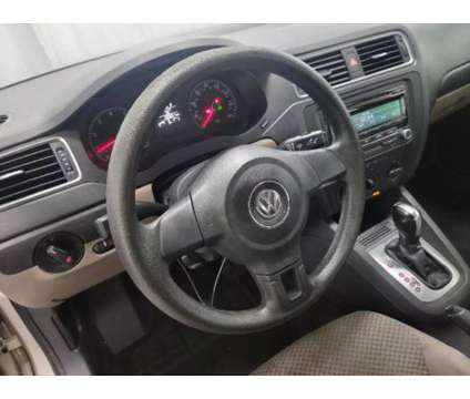 2014 Volkswagen Jetta for sale is a Tan 2014 Volkswagen Jetta 2.5 Trim Car for Sale in Charlotte NC