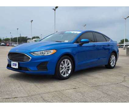 2020 Ford Fusion SE is a Blue 2020 Ford Fusion SE Car for Sale in Corpus Christi TX