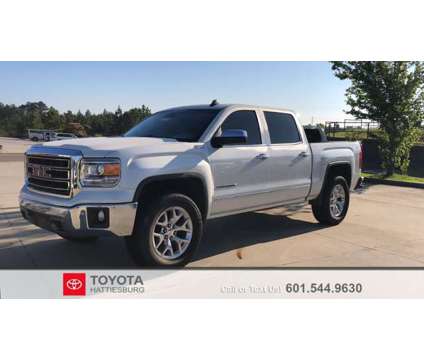 2015 GMC Sierra 1500 SLT is a White 2015 GMC Sierra 1500 SLT Car for Sale in Hattiesburg MS