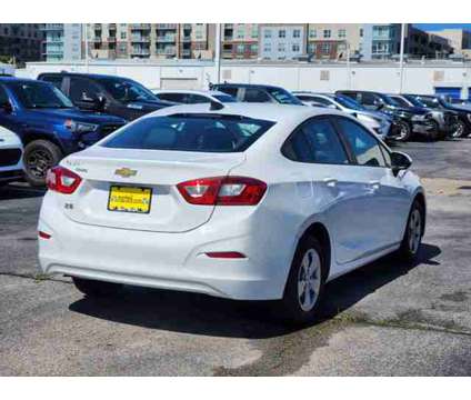 2018 Chevrolet Cruze Ls is a White 2018 Chevrolet Cruze LS Car for Sale in Houston TX