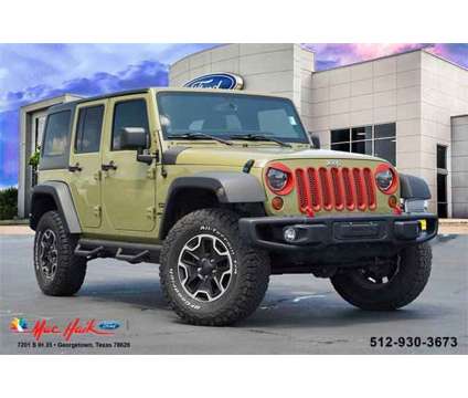 2013 Jeep Wrangler Unlimited Sport is a Green 2013 Jeep Wrangler Unlimited Sport Car for Sale in Georgetown TX