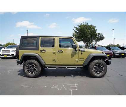 2013 Jeep Wrangler Unlimited Sport is a Green 2013 Jeep Wrangler Unlimited Sport Car for Sale in Georgetown TX