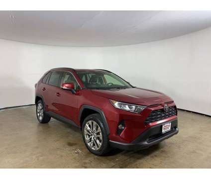 2021 Toyota RAV4 XLE Premium is a Red 2021 Toyota RAV4 XLE Car for Sale in Peoria IL