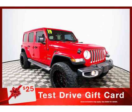 2019 Jeep Wrangler Unlimited Sahara is a Red 2019 Jeep Wrangler Unlimited Sahara Car for Sale in Tampa FL