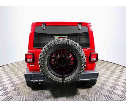 2019 Jeep Wrangler Unlimited Sahara is a Red 2019 Jeep Wrangler Unlimited Sahara Car for Sale in Tampa FL