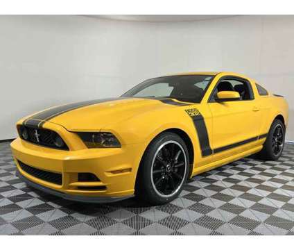 2013 Ford Mustang Boss 302 is a Yellow 2013 Ford Mustang Boss 302 Coupe in Issaquah WA